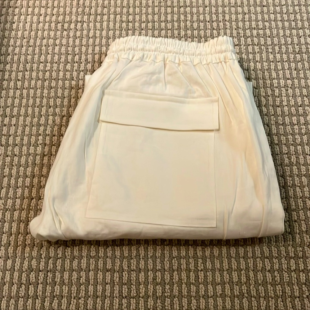 Vince, white pants.